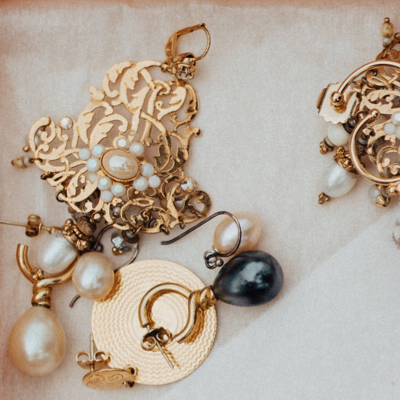 close-up of pearl and golden earrings